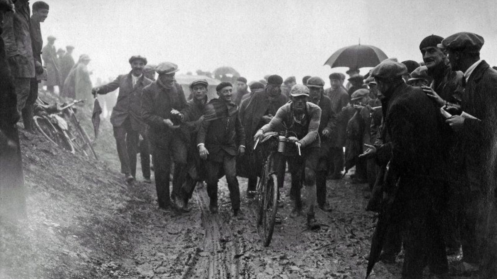 Lucien Buysse surronded by cycling fans on the harderst Tour de France stage ever ( 1926 Stage 20)