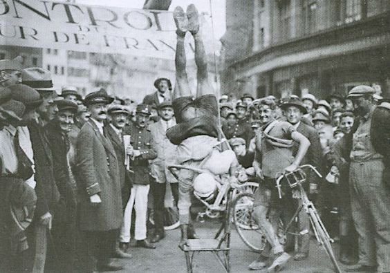 Vintage cycling images of French cyclist Jules Deloffre the acrobat rider entertaining the crowd after a stage at Tour de France 