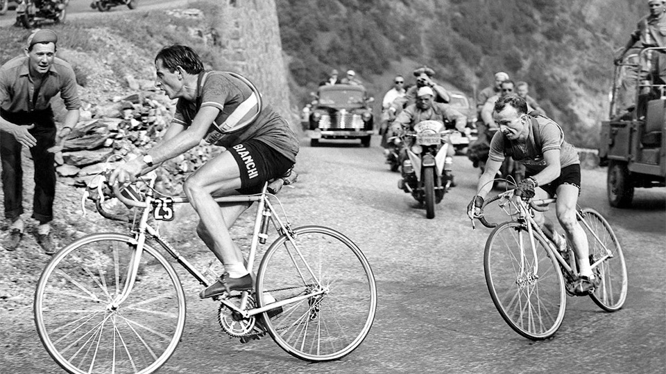 Jean Robic tries to keep up with Fausto Coppi on Alpe d'Huez at the Tour de France 1952