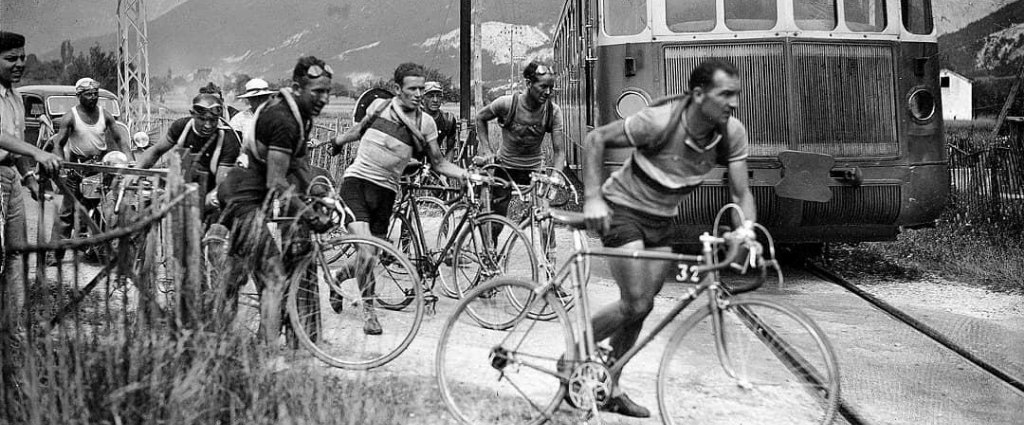 Roger Lapebie crossing the railway before the train arrives. Tour de France 1937.