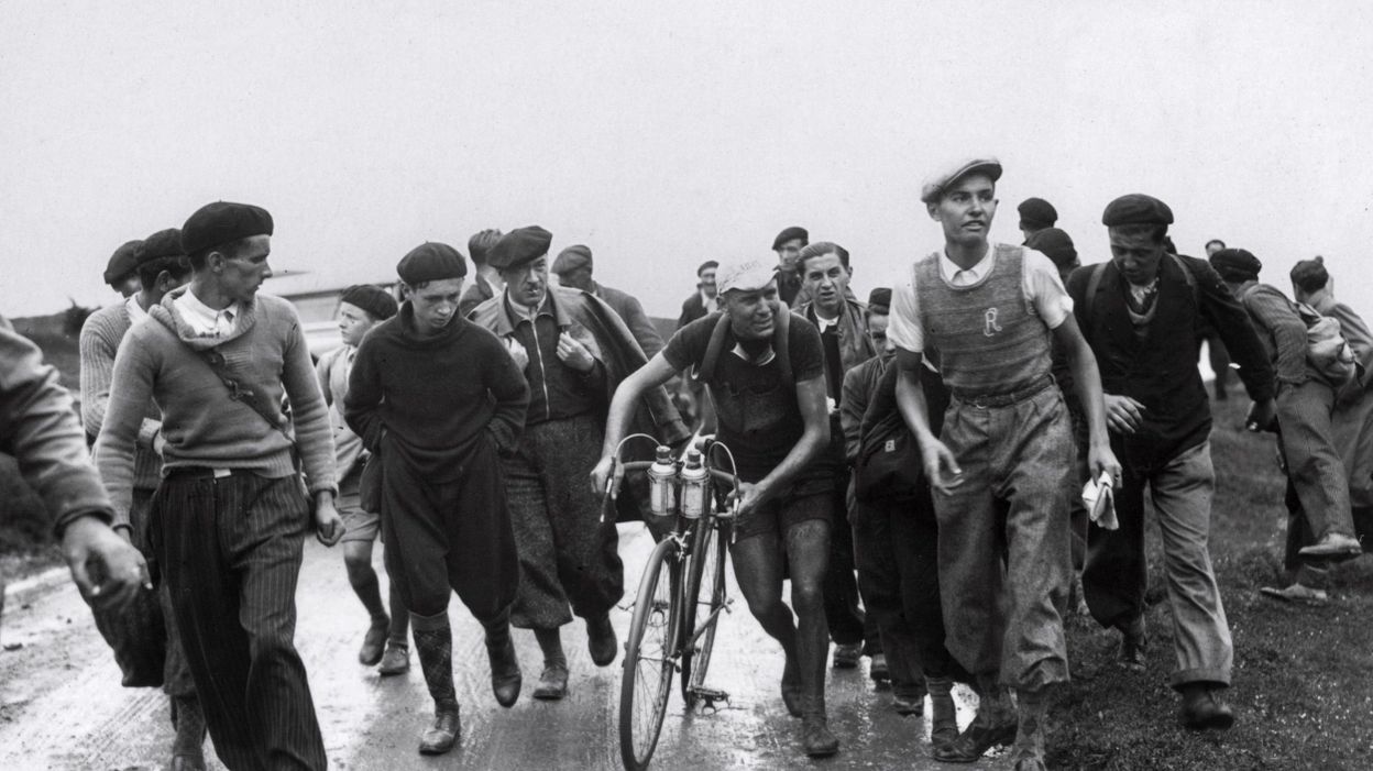 Felicien Felicien Vervaecke surrounded by cycling fans on Tourmalet at the Tour de France 1936.