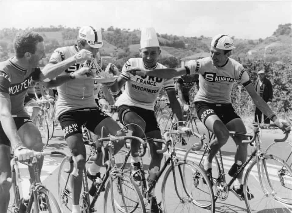 Cyclists eating pasta at the Giro d'Italia 1966 