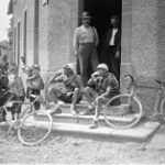 Two cyclists are drinking a beer at the Tour de France 1921