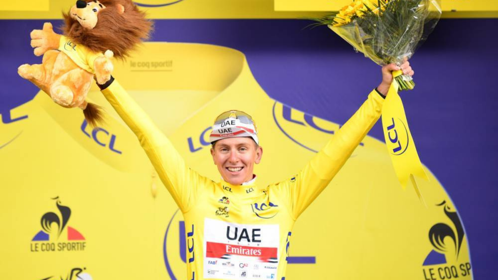 Tadej Pogacar celebrates his yellow jersey at Tour de France 2021