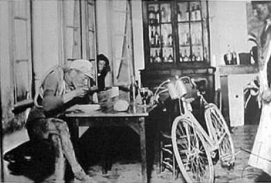 A cyclist eating in a pub at the Tour de France, a boy looking in into a window