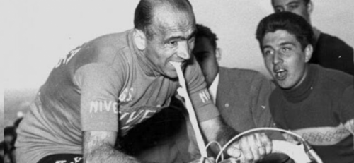 Famous black and withe image of Italian cyclist Fiorenzo Magni, holding an inner tube between his teeth during the Giro d'Italia in 1956