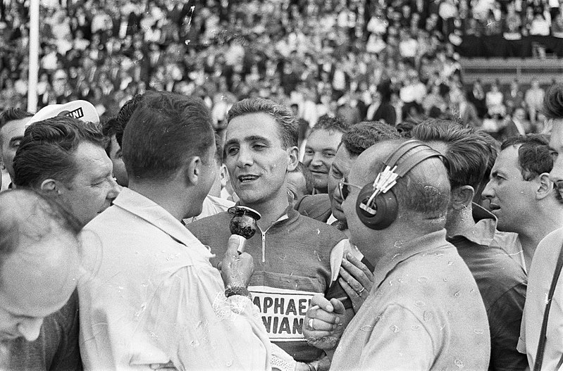 French cyclist Roger Rivière surrounded by journalists at the Tour de France in 1960