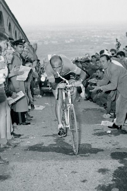 Italian cyclist and three time Giro d'Italia winner Fiorenzo Magni fightijg with broken collarbone at the Giro d'Italia 1956