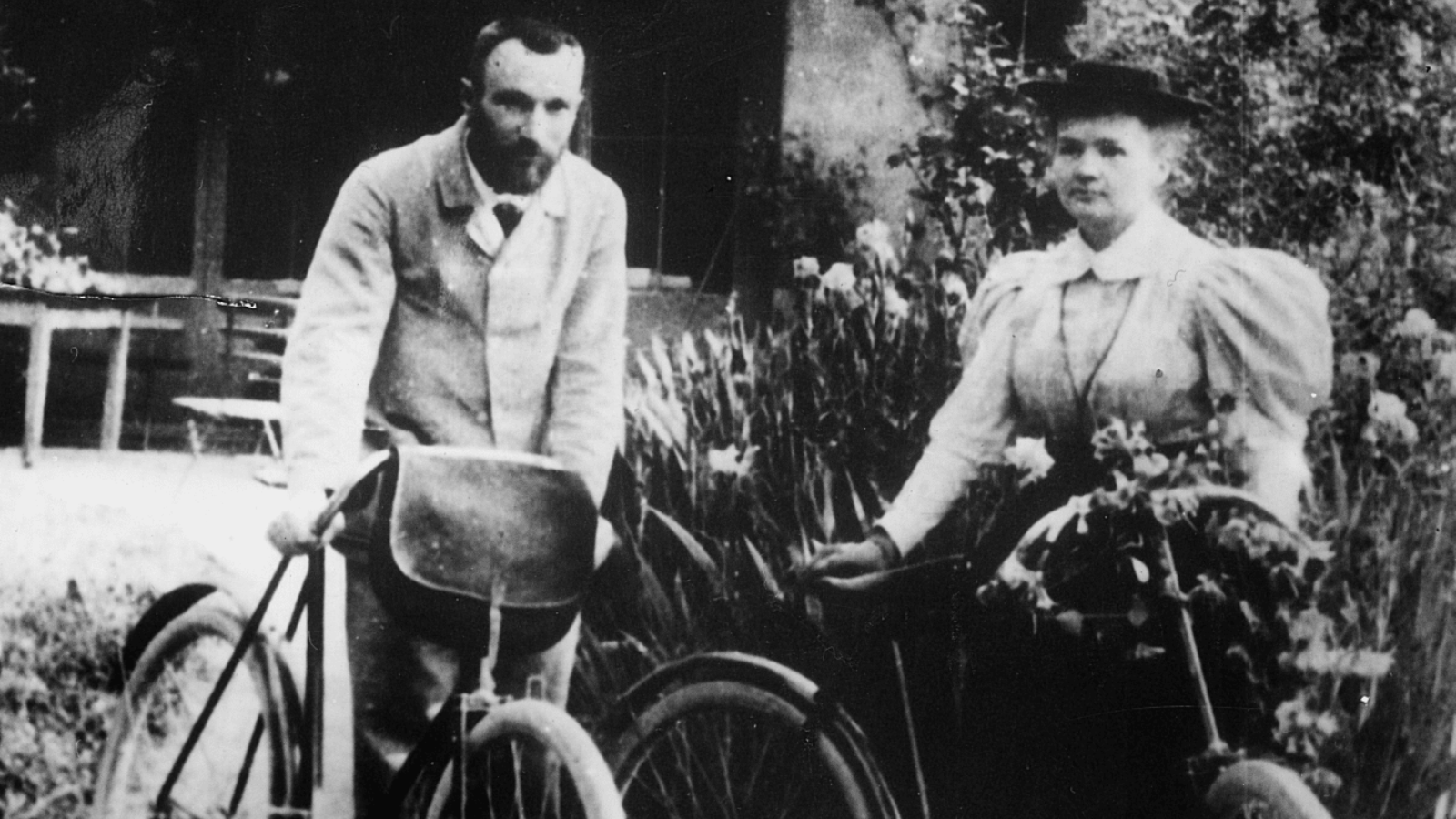 The famous scientist couple, Marie and Pierre Curie with their bicycles on their honeymoon in 1895