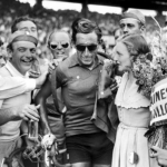Famous picture of Fausto Coppi with sun glasses celebrating his Tour de France victory in 1949