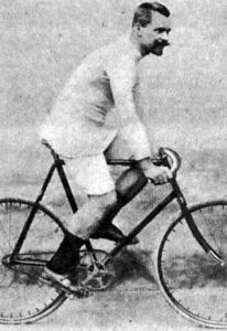 Josef Fischer, winner of the first Paris-Roubaix is posing on his bicycle