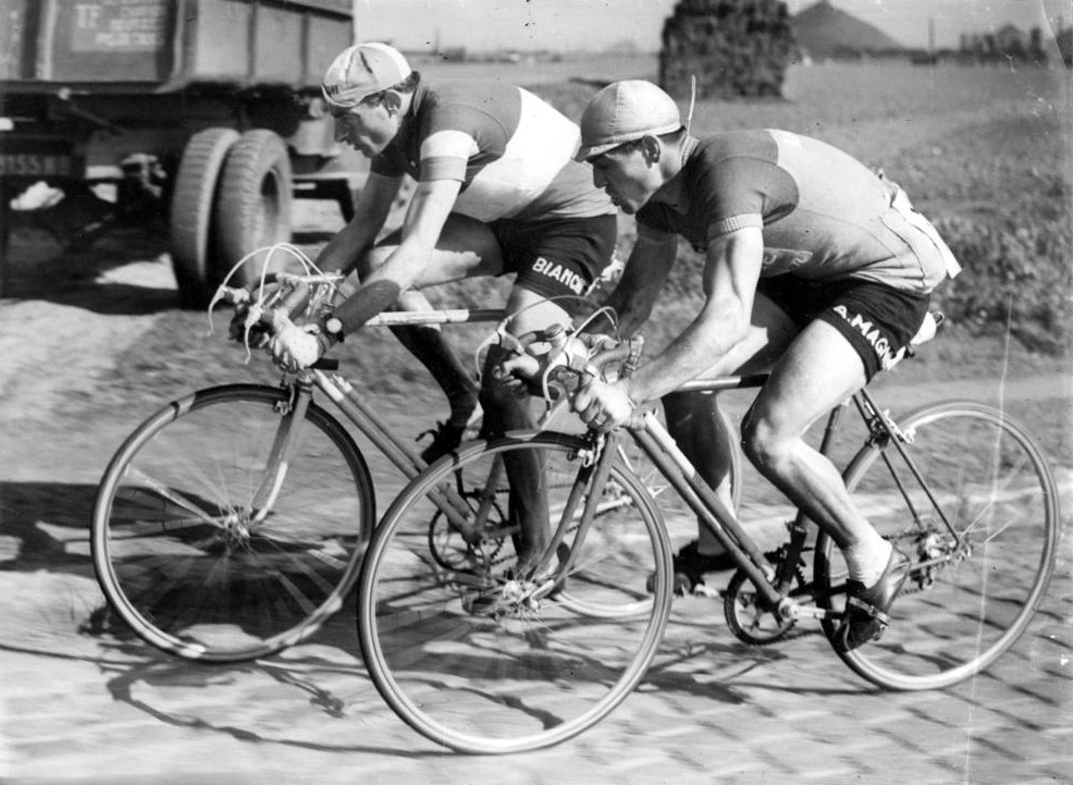 A moment of Paris-Roubaix 1950: Fausto Coppi and Maurice Diot riding on the cobbles side by side 