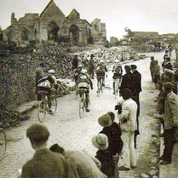 Cyclists are riding amoung ruins after World War I at Paris-Roubaix in 1919