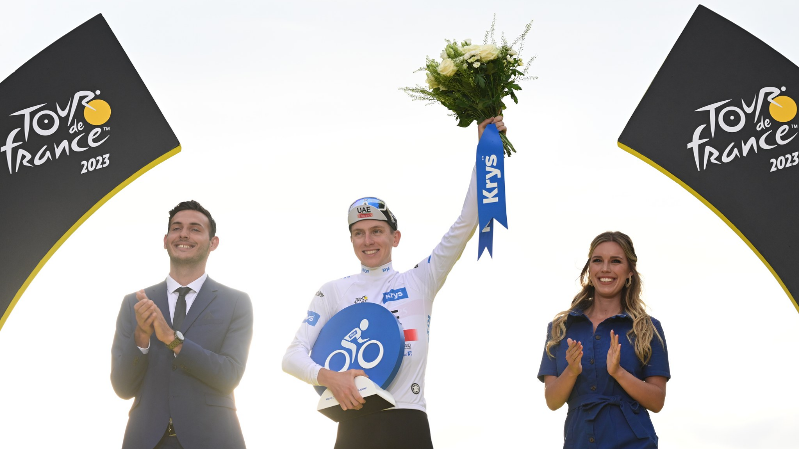 Tadej Pogacar celebrating his white jersey in Paris at the Tour de France 2023