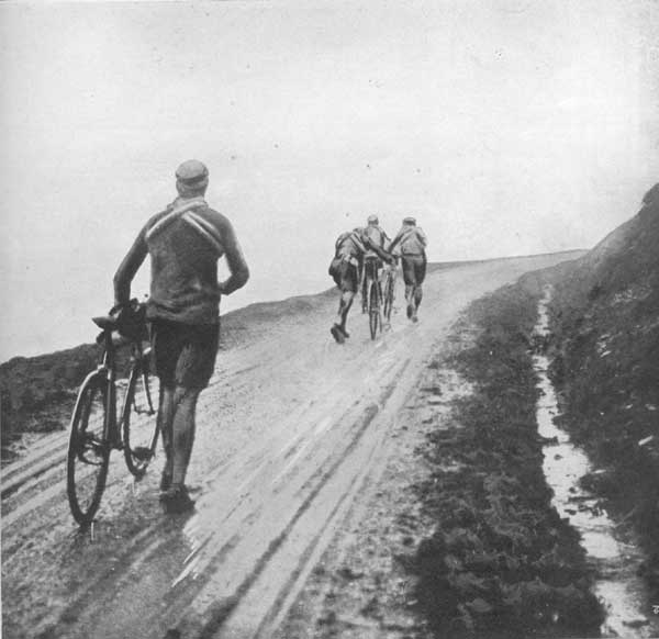 Past might be a better place in our imagination, but certanly the roads in the Pyrenees were not better 110 years ago. Philippye Thys, Eugène Christophe and Gustave Garrigou fightijg with the elements during the Tour de Frwnce in 191e