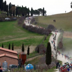 A moment from the scenic sping road cycling race Strade Bianche, when the peloton hits the white gravel road of the popular Tuscan hills in the middle of Italy.