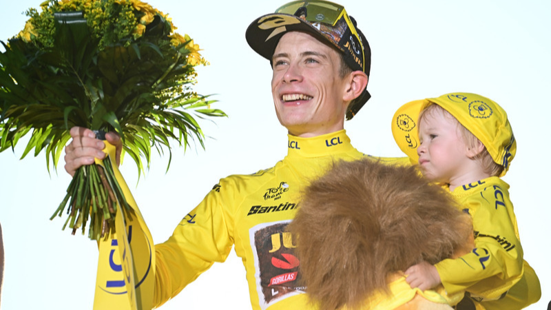 Danish cyclist Jonas Vingegaard celebrating his first Tour de France victory in Paris in 2022