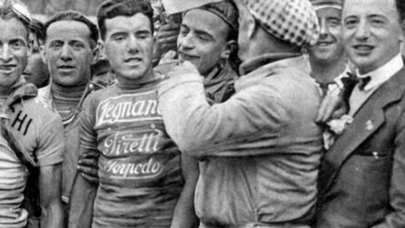 In the middle of the picture is the Italian cyclist Luigi Marchisio, winner of Giro d'Italia 1930