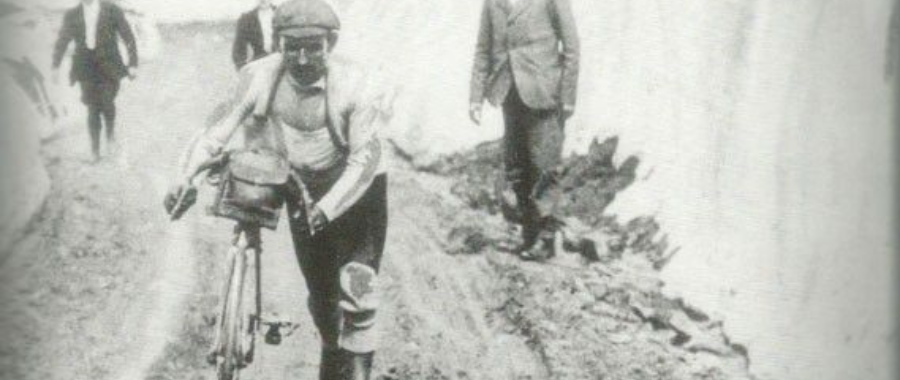 Emile Georget struggling through the snowy and unpaved roads in the Alps, possibly on Galibier during Tour de France 1911