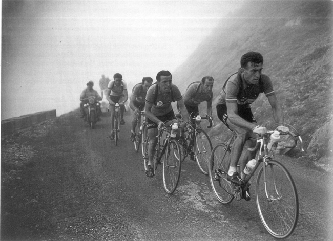 Louison Bobet leading a bunch of cyclists up to Aubisque during the 11th stage in the Pyrenees at Tour de France 1954