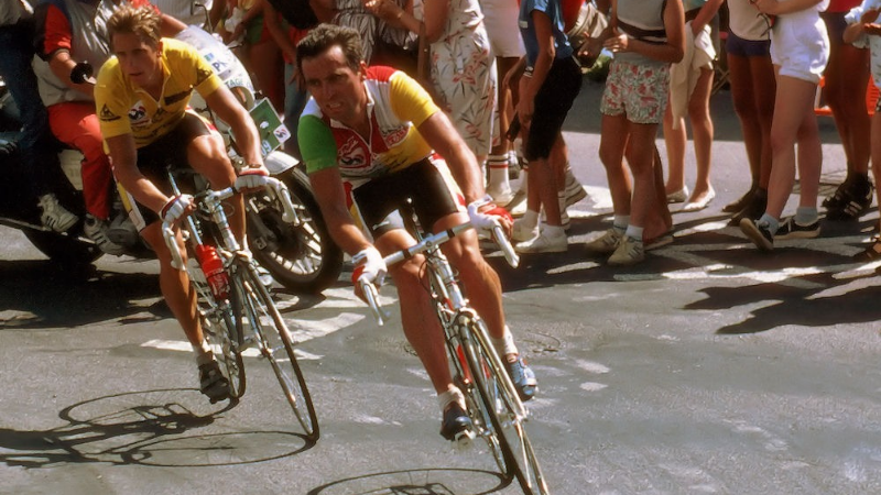 Greg Lemond and Bernard Hinault riding together during Tour de Frsnce 1986